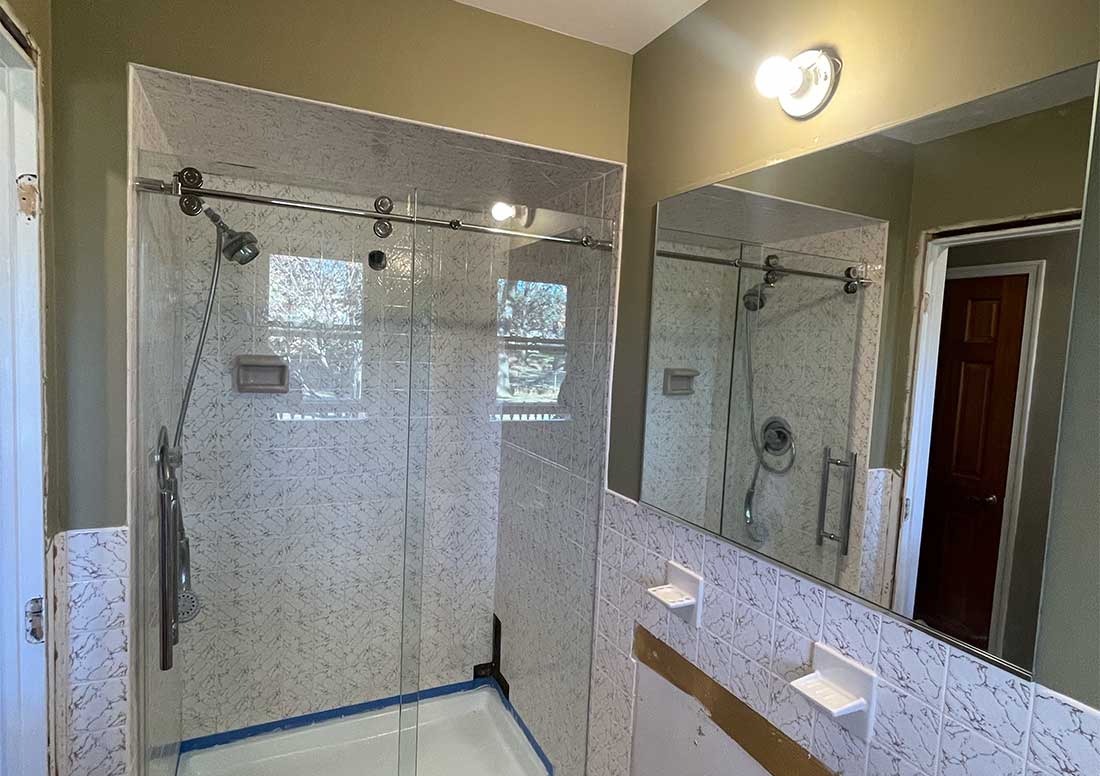 Frameless glass shower door installation